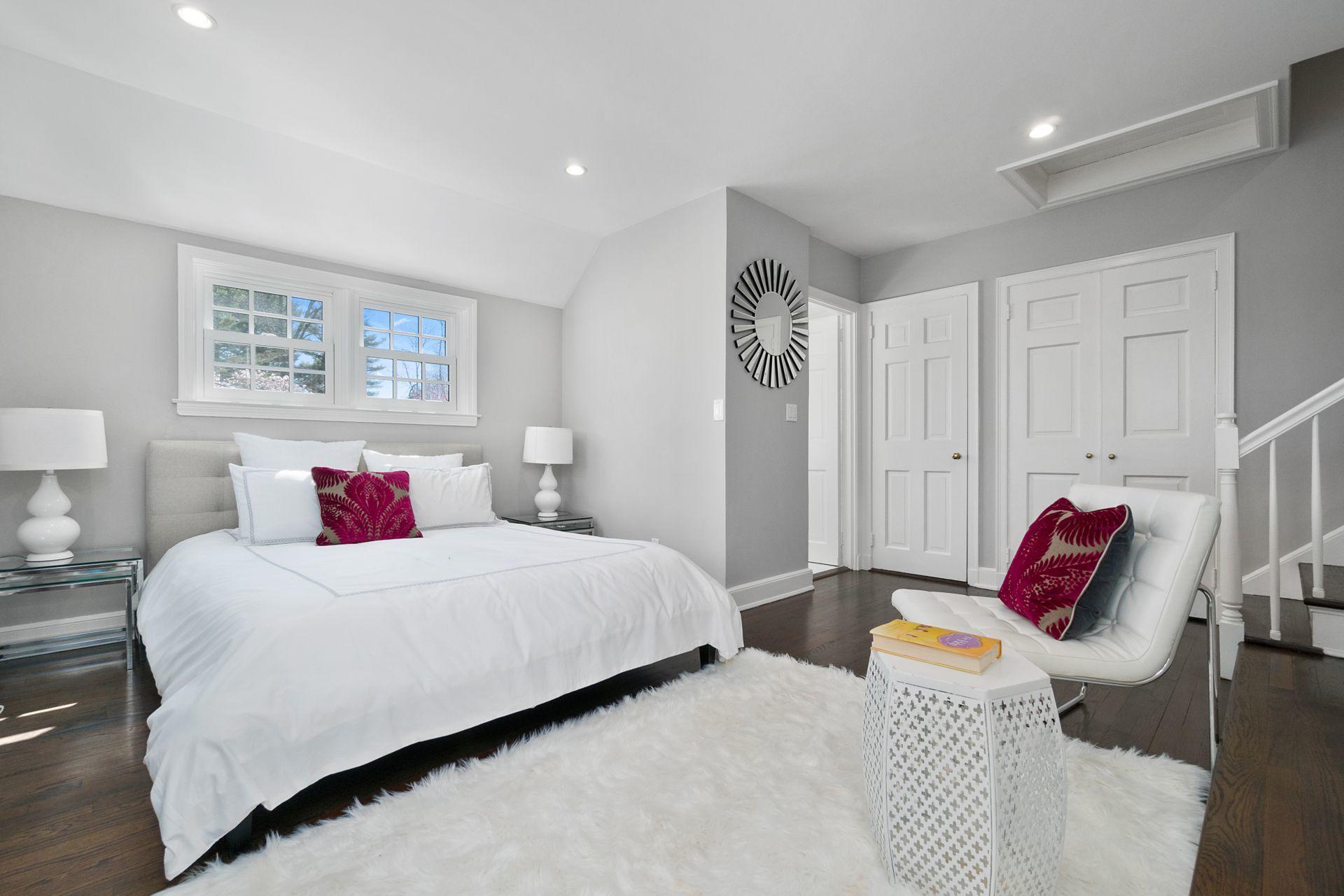 1102 Oenoke Ridge New Canaan, CT 06840 - Photo 27 of 49 a bedroom with a bed and closet