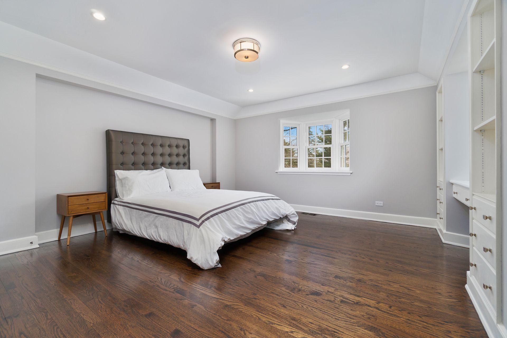 1102 Oenoke Ridge New Canaan, CT 06840 - Photo 32 of 49 a bedroom with a bed and a window