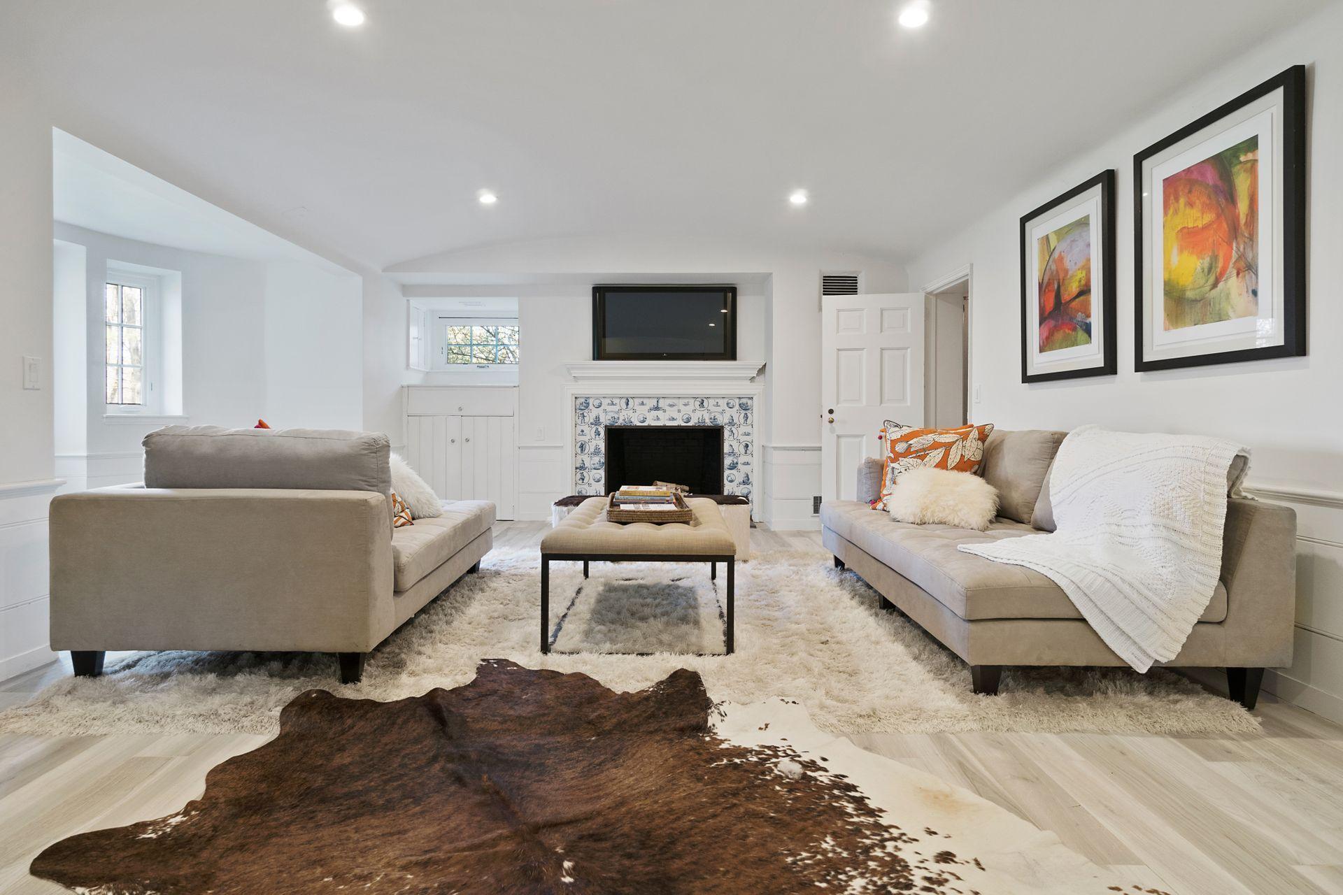 1102 Oenoke Ridge New Canaan, CT 06840 - Photo 34 of 49 a living room with furniture and a fireplace