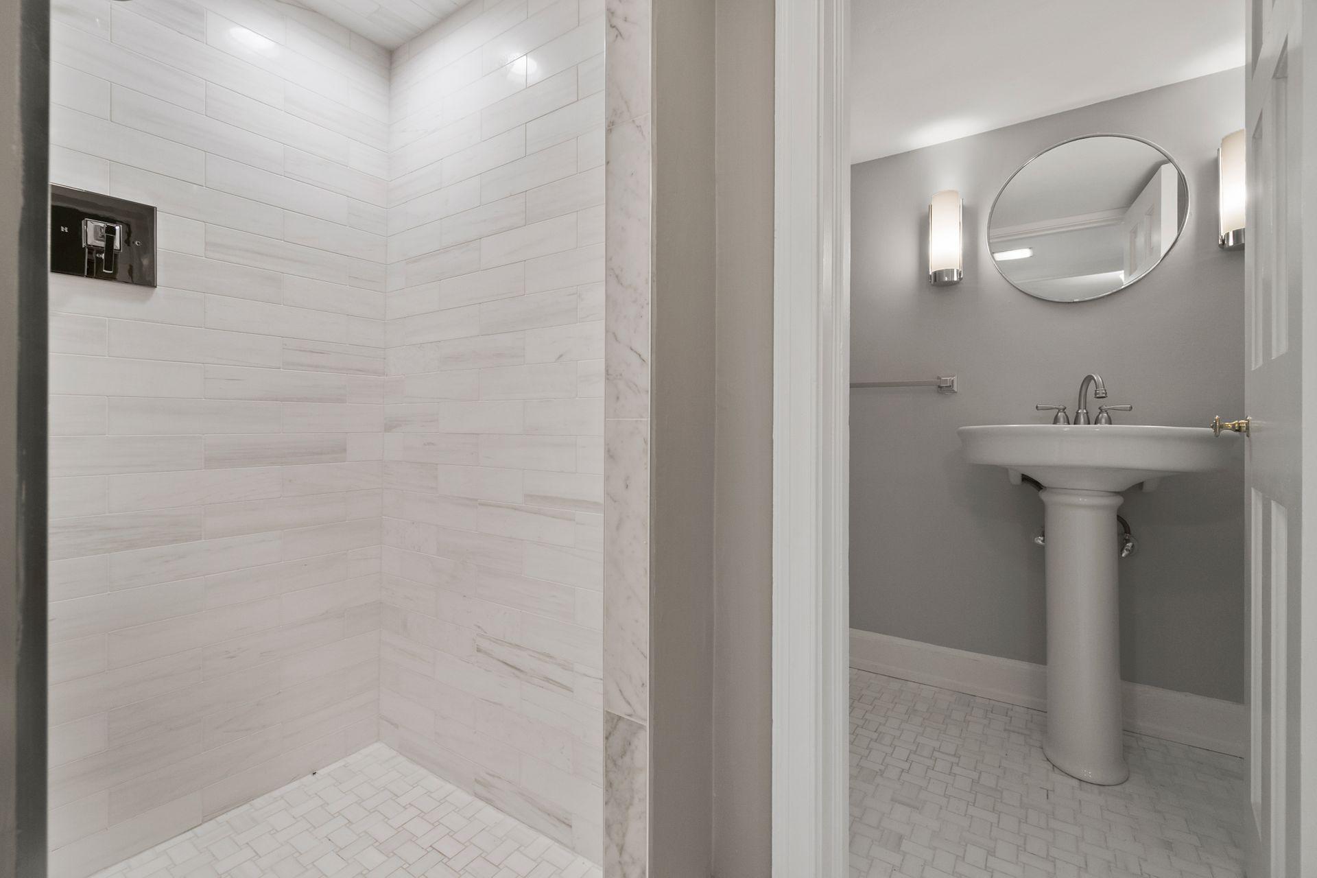 1102 Oenoke Ridge New Canaan, CT 06840 - Photo 35 of 49 a bathroom with a sink and mirror
