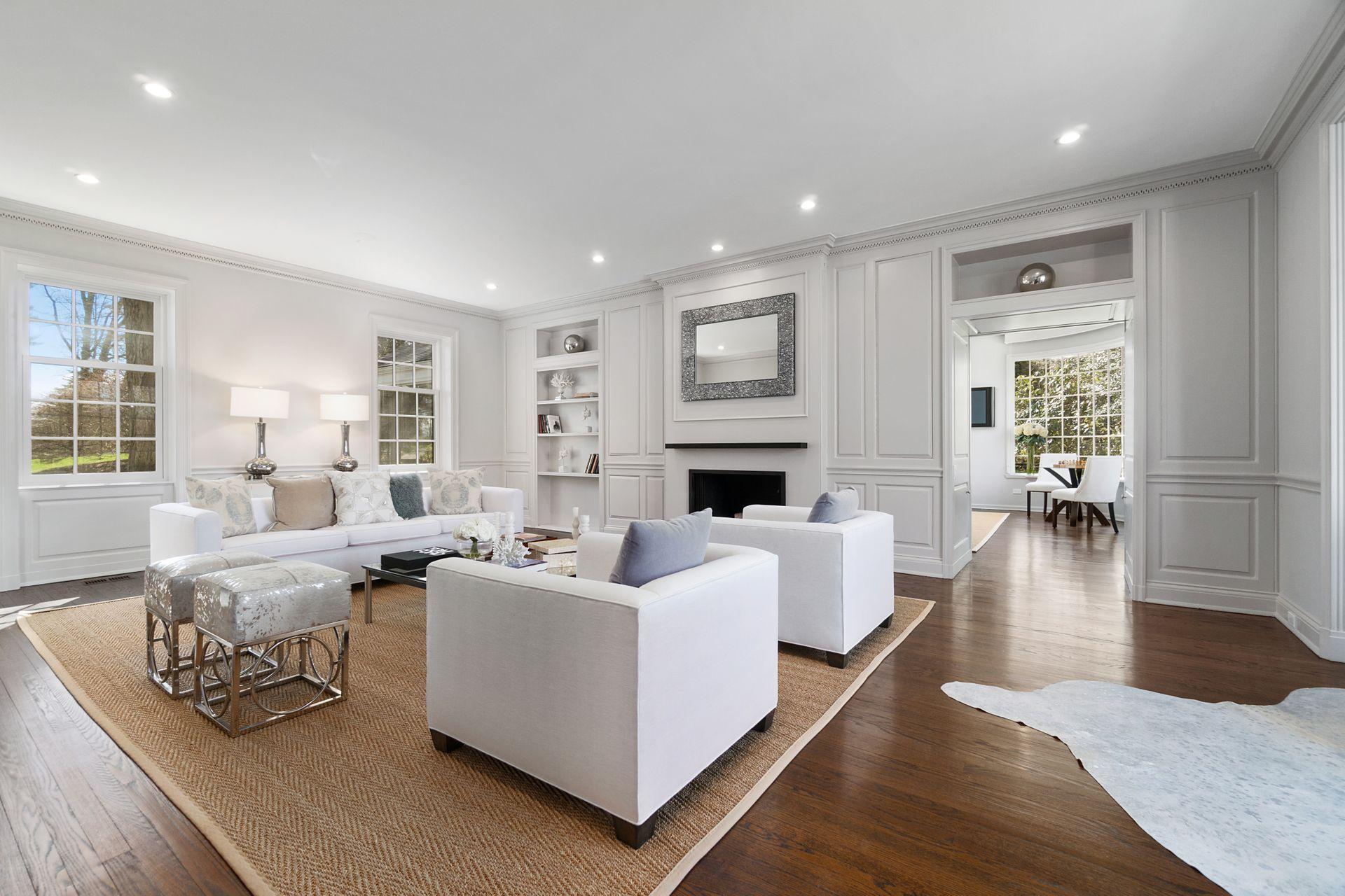 1102 Oenoke Ridge New Canaan, CT 06840 - Photo 5 of 49 a living room with fireplace furniture and a wooden floor