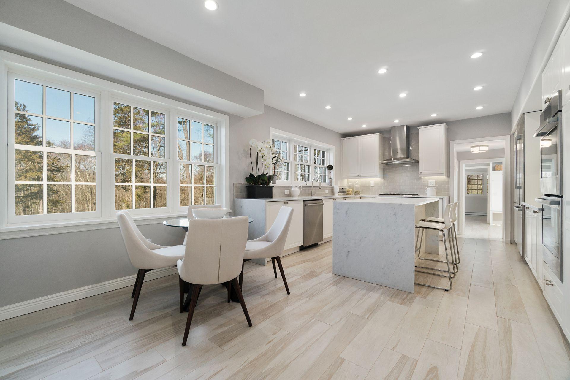 1102 Oenoke Ridge New Canaan, CT 06840 - Photo 7 of 49 a view of a dining room with furniture a rug and wooden floor