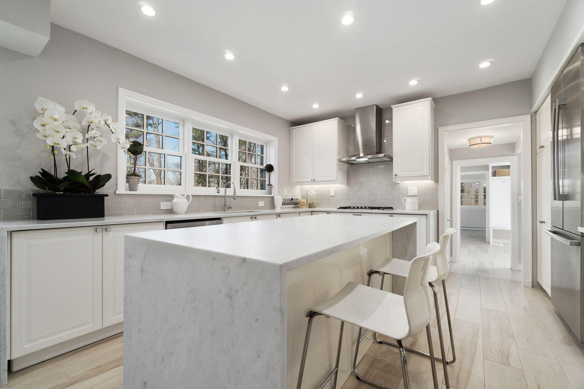 1102 Oenoke Ridge New Canaan, CT 06840 - Photo 10 of 49 a kitchen with a sink and cabinets
