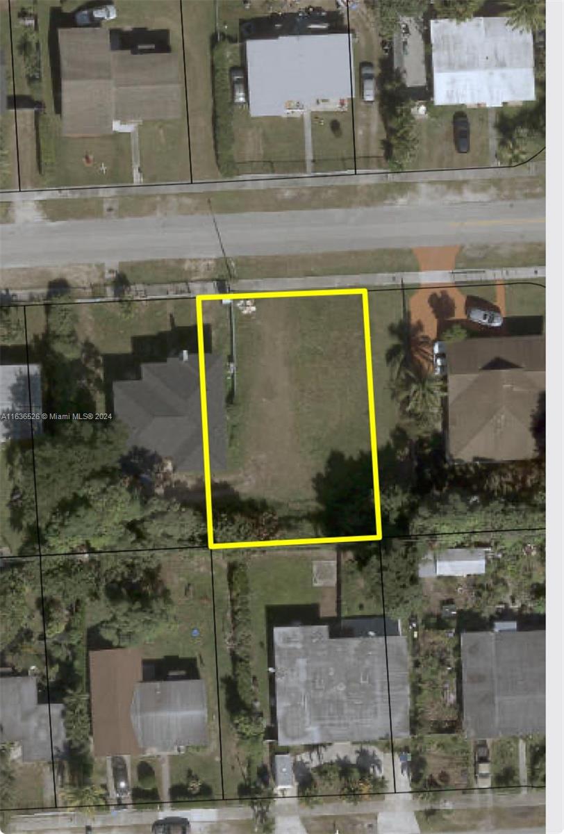 10210 Southwest 170th Terrace Miami, FL 33157 - Photo 2 of 2 an aerial view of residential houses with outdoor space