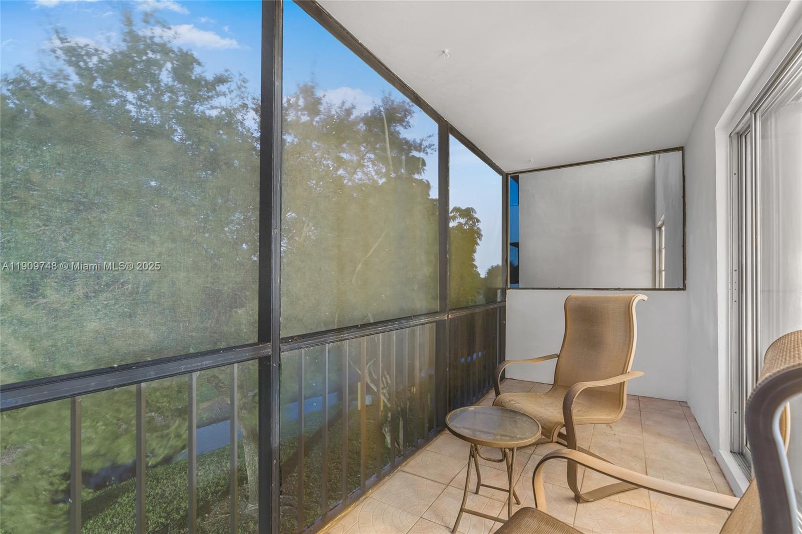 4166 Inverrary Drive, Unit 306 Lauderhill, FL 33319 - Photo 15 of 30 a balcony with table and chairs