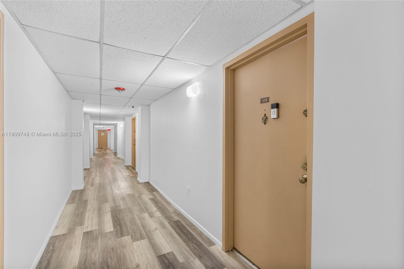 4166 Inverrary Drive, Unit 306 Lauderhill, FL 33319 - Photo 22 of 30 a view of a hallway with wooden floor