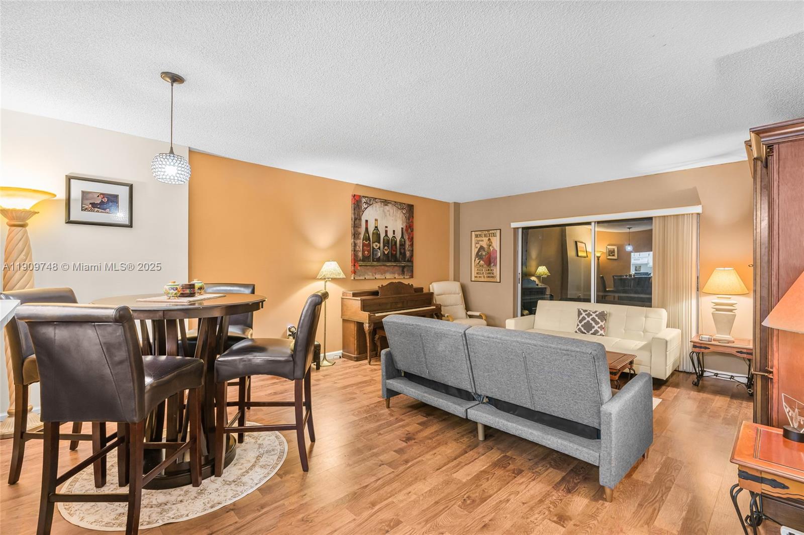 4166 Inverrary Drive, Unit 306 Lauderhill, FL 33319 - Photo 6 of 30 a living room with fireplace furniture and a wooden floor