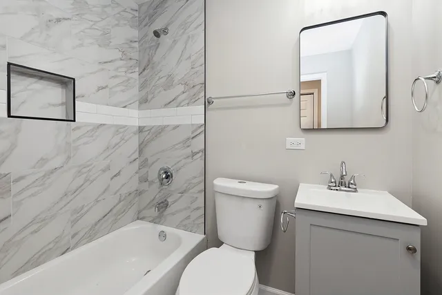 a bathroom with a toilet sink and a bathtub