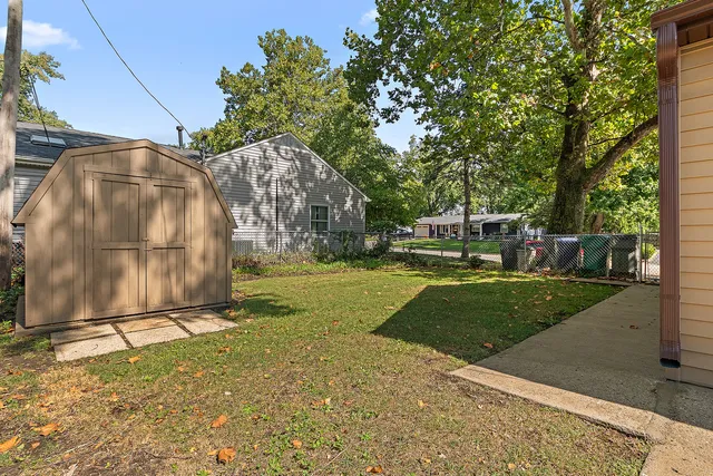 a view of a park with large trees