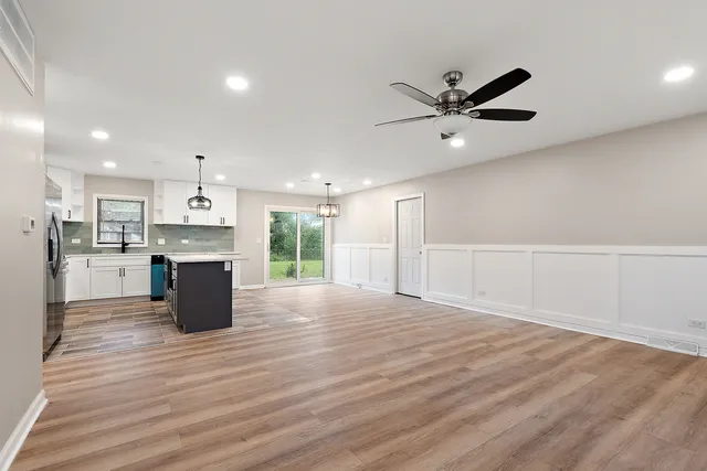a view of kitchen with wooden floor and window