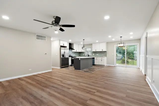 a view of kitchen with wooden floor