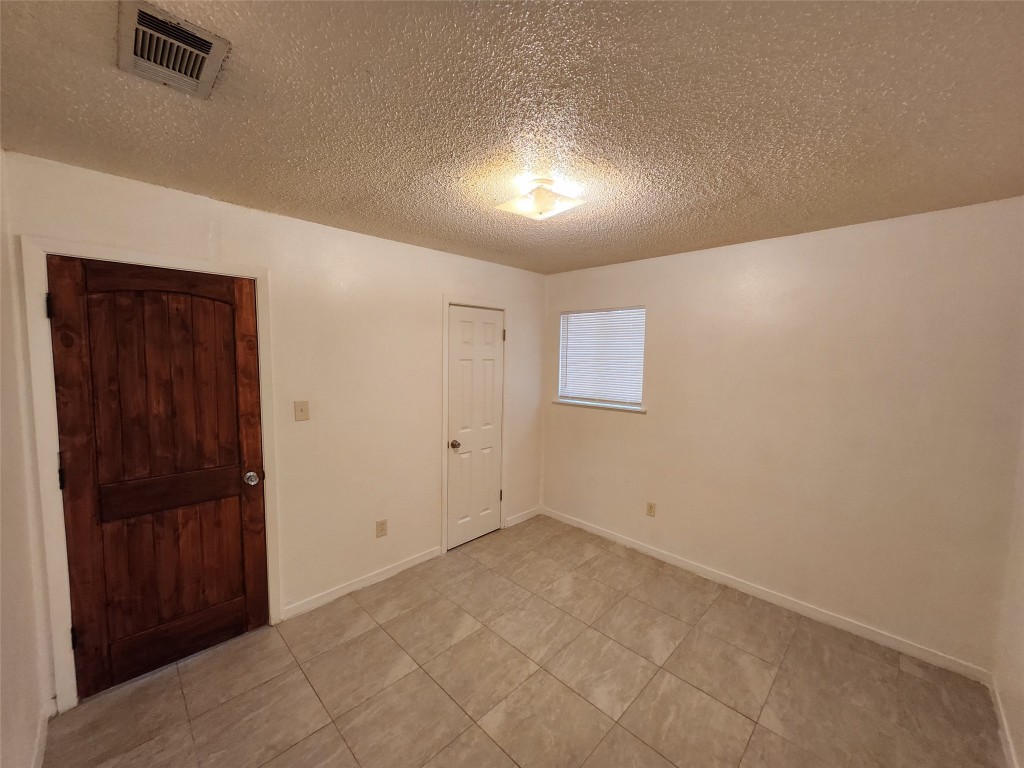2404 Audubon Place, Unit B Austin, TX 78741 - Photo 15 of 23 an empty room with windows