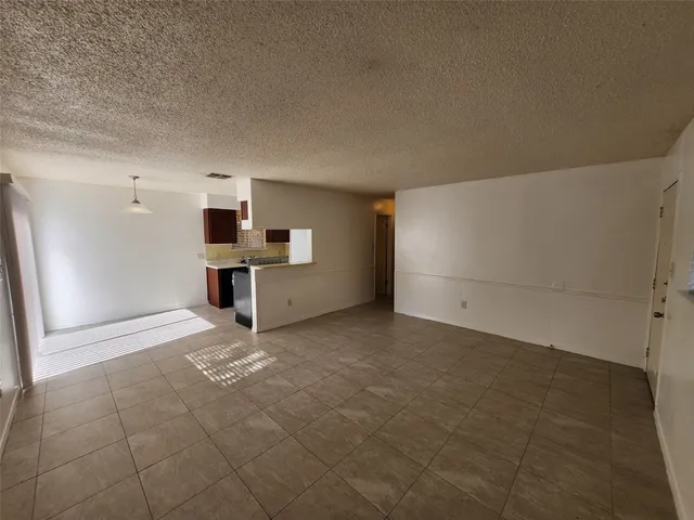 a view of a kitchen with a sink