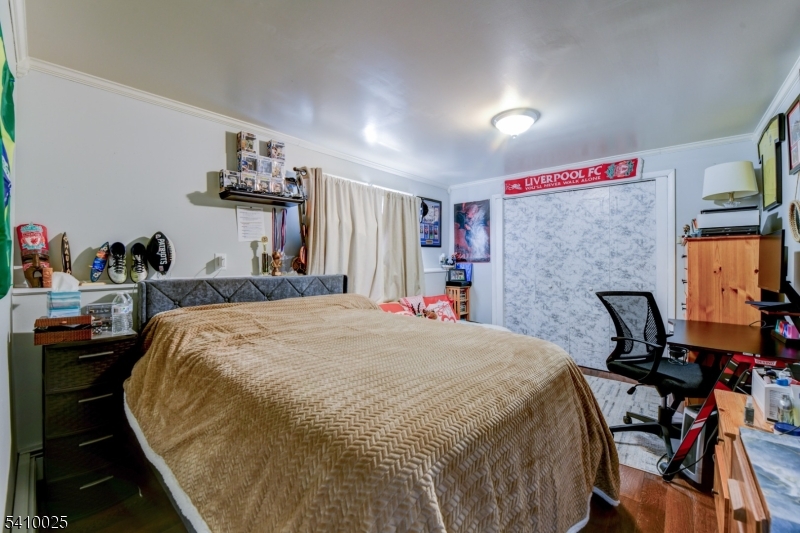 21 Normandy Circle Hopatcong, NJ 07843 - Photo 13 of 22 a bed room with a bed and a chair