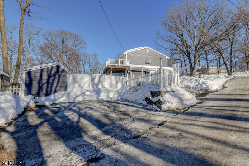 21 Normandy Circle Hopatcong, NJ 07843 - Photo 20 of 22 a view of a house with a yard covered with snow