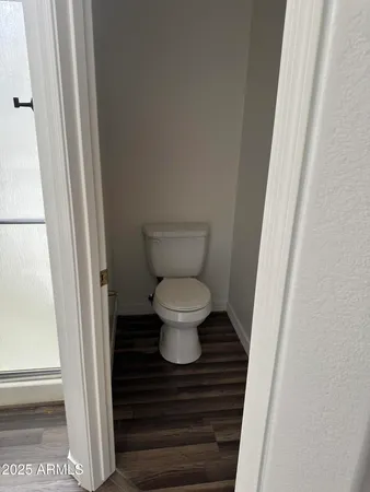 a bathroom with a toilet and a sink