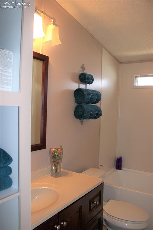 728 Graphite Street Florence, CO 81226 - Photo 17 of 30 a bathroom with a sink a toilet and shower