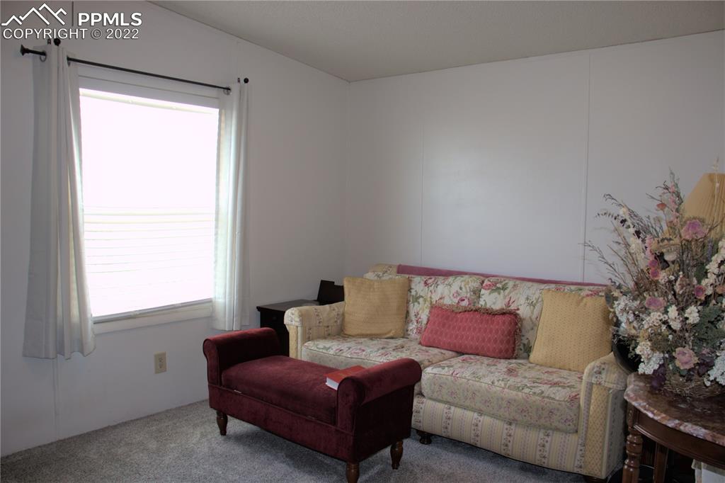 728 Graphite Street Florence, CO 81226 - Photo 19 of 30 a living room with furniture and a window