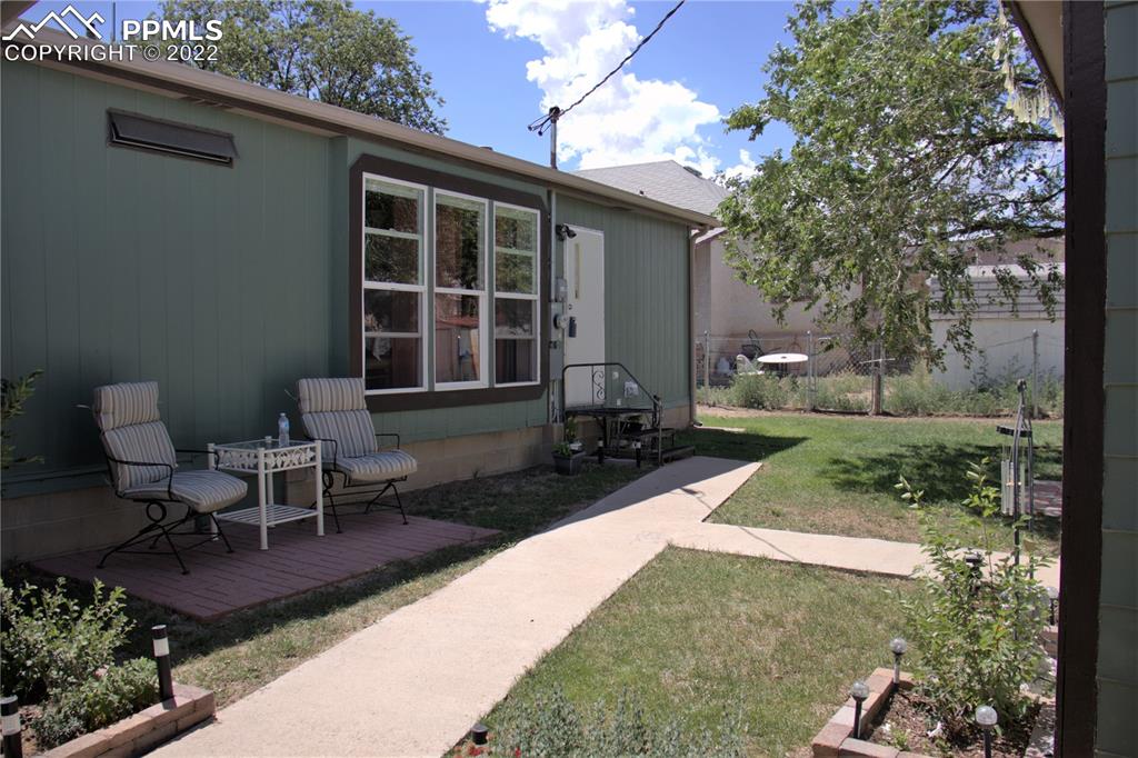 728 Graphite Street Florence, CO 81226 - Photo 22 of 30 a view of a backyard with sitting area