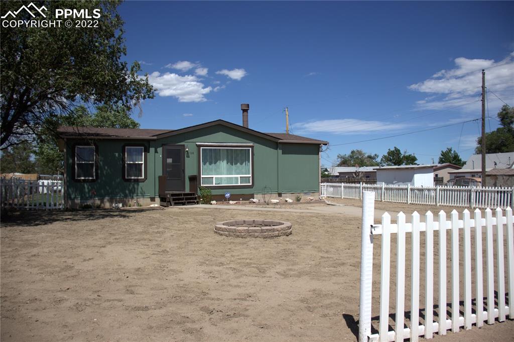 728 Graphite Street Florence, CO 81226 - Photo 29 of 30 a front view of a house with yard