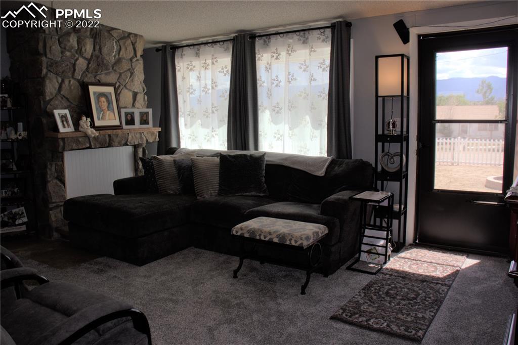 728 Graphite Street Florence, CO 81226 - Photo 3 of 30 a living room with furniture and a window