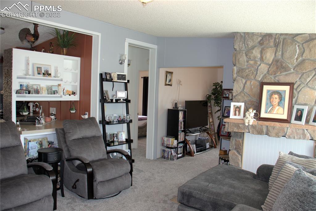 728 Graphite Street Florence, CO 81226 - Photo 4 of 30 a living room with furniture and wooden floor