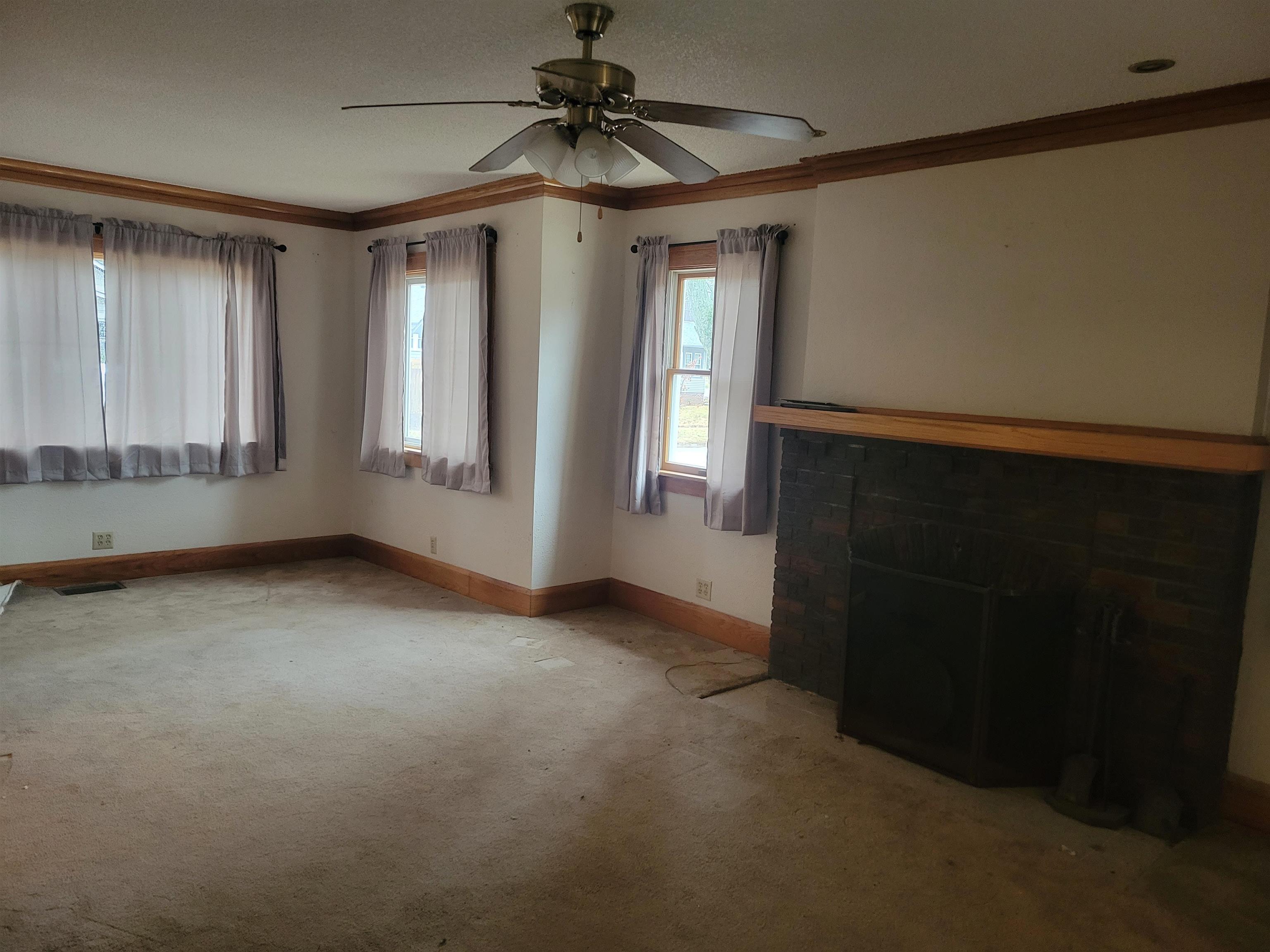 1908 Rural Street Rockford, IL 61107 - Photo 4 of 19 a view of empty room with windows