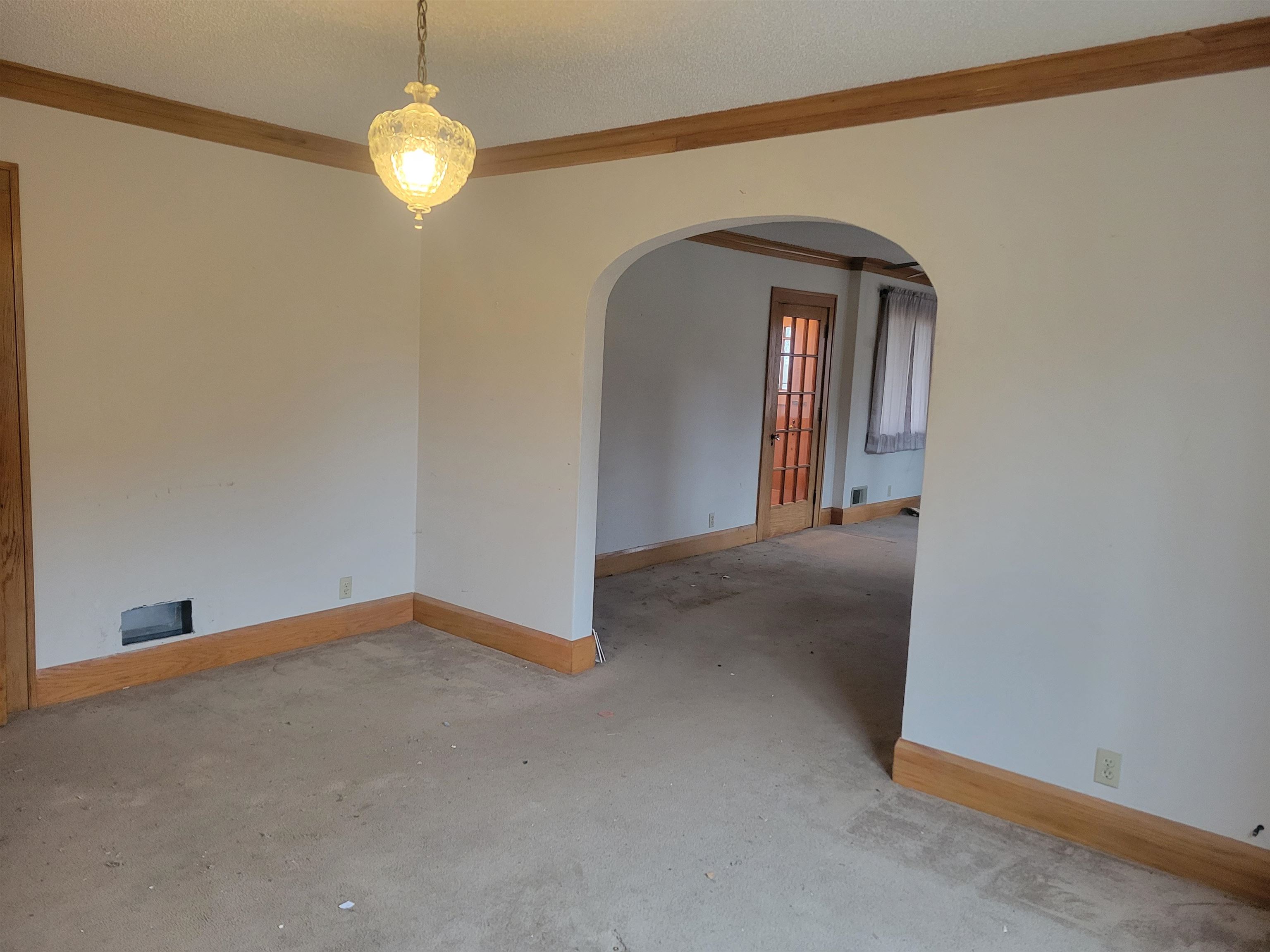 1908 Rural Street Rockford, IL 61107 - Photo 7 of 19 a view of a room with a hanging light and wood floor