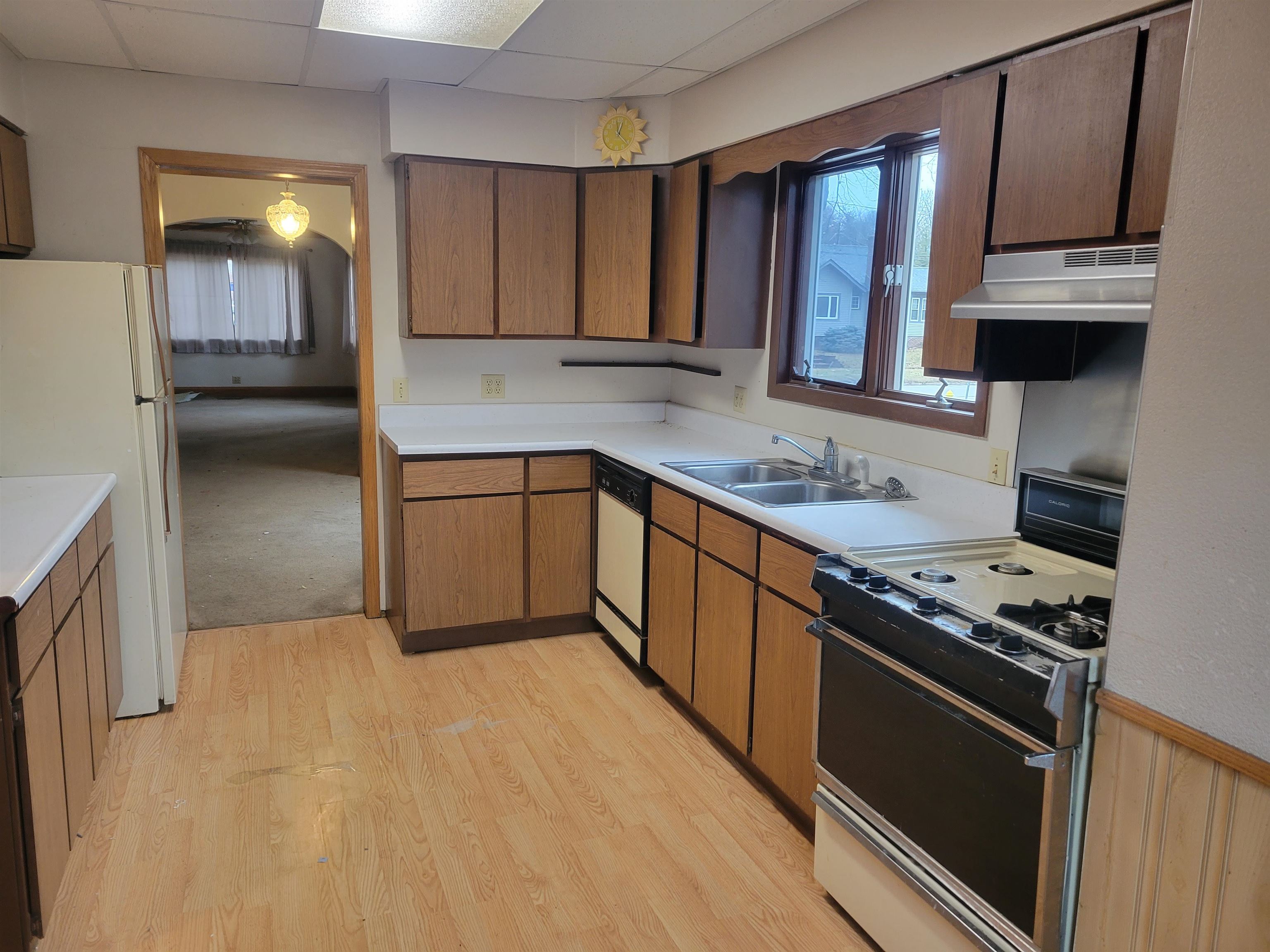 1908 Rural Street Rockford, IL 61107 - Photo 9 of 19 a kitchen with stainless steel appliances granite countertop a stove a sink and a refrigerator