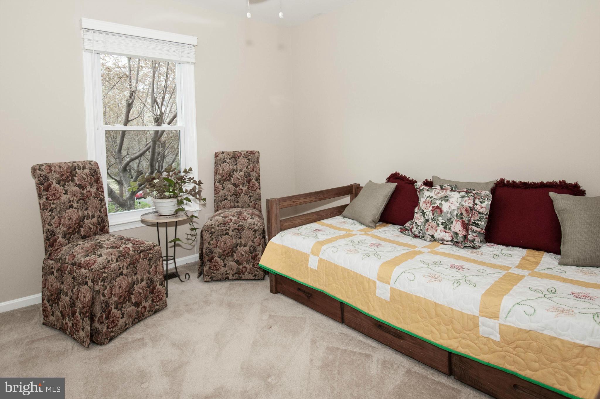 11662 Havenner Road Fairfax Station, VA 22039 - Photo 24 of 30 a bedroom with a bed and a couch