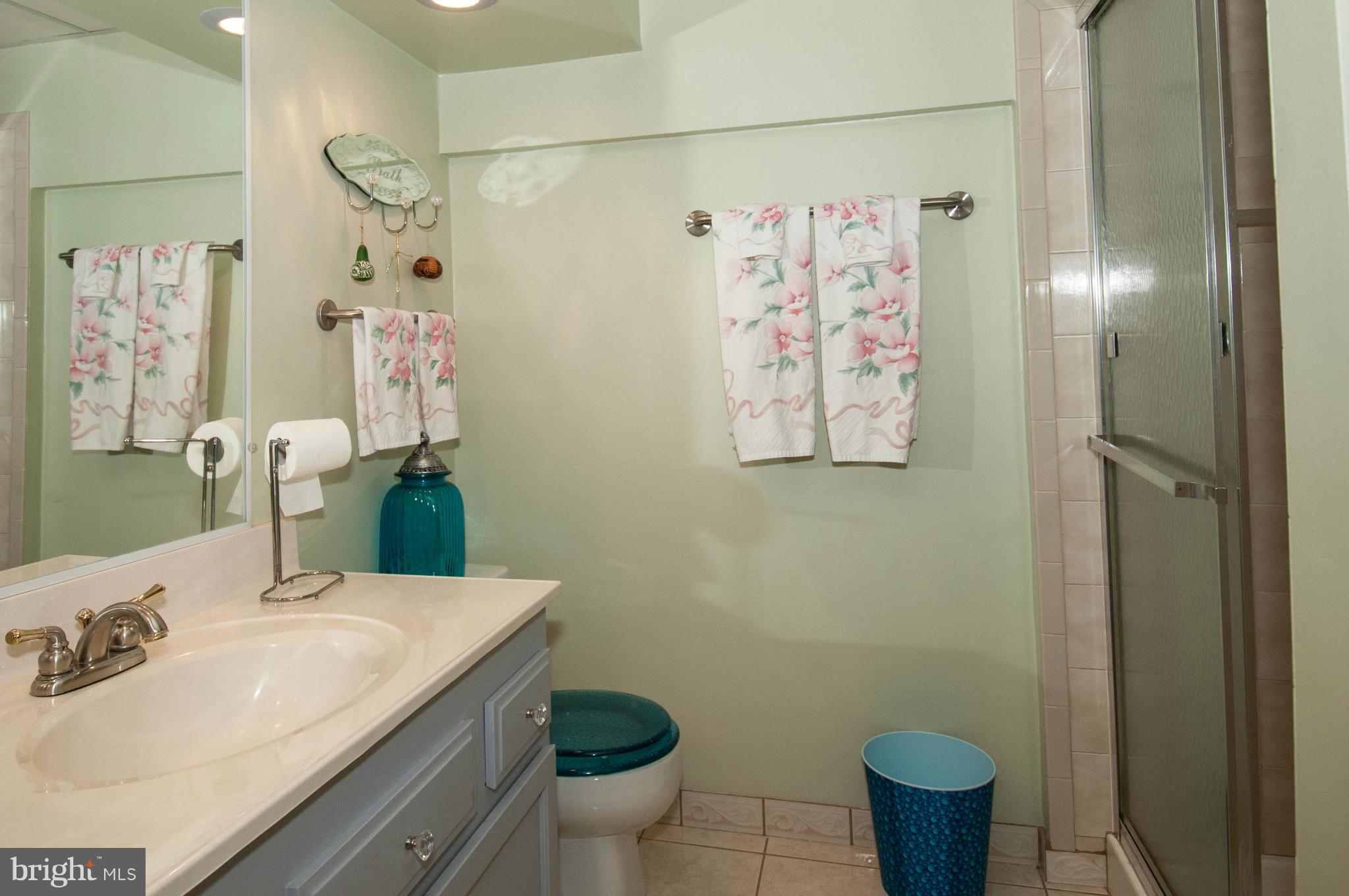 11662 Havenner Road Fairfax Station, VA 22039 - Photo 26 of 30 a bathroom with a granite countertop sink and a mirror