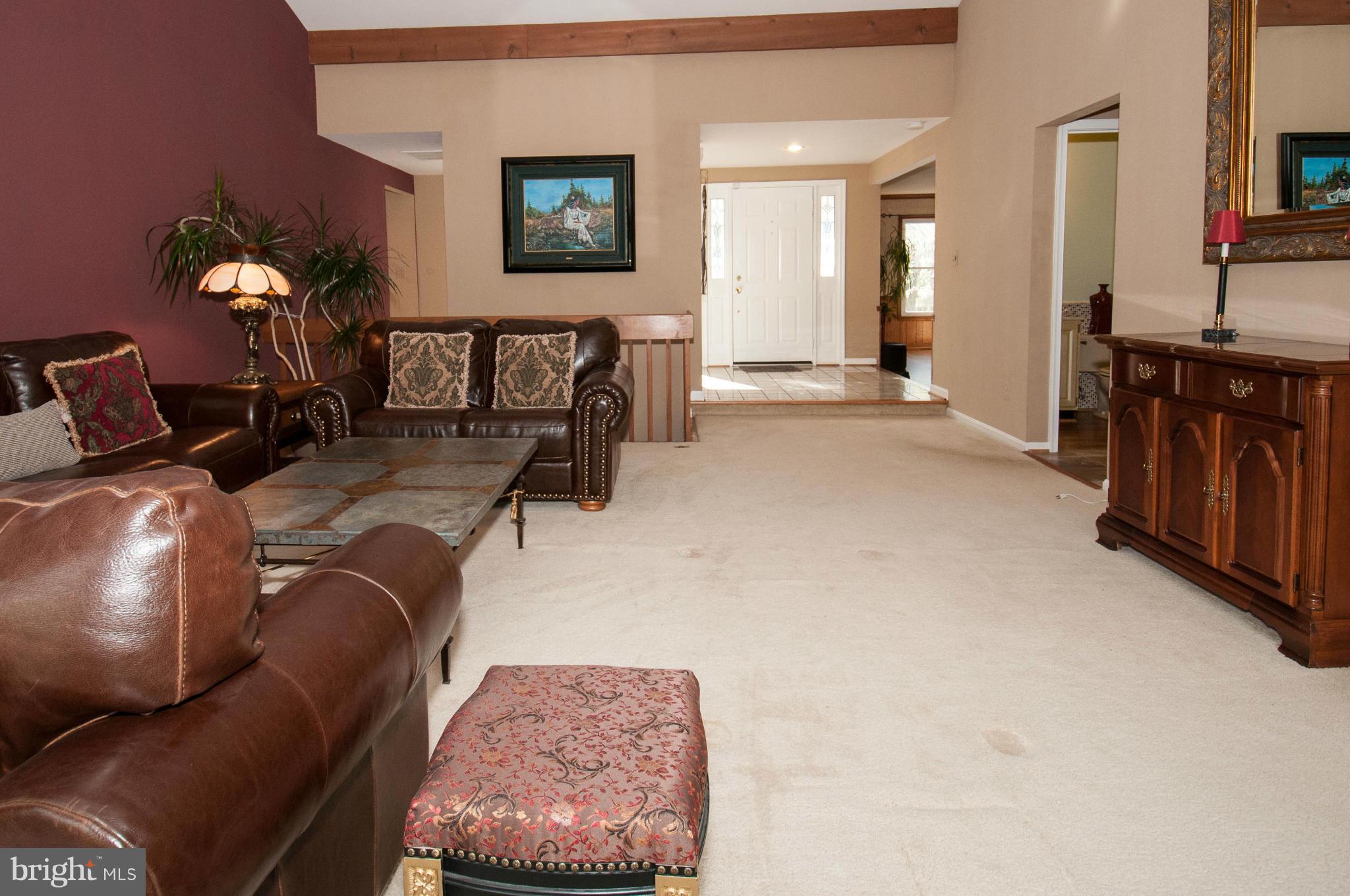 11662 Havenner Road Fairfax Station, VA 22039 - Photo 8 of 30 a living room with furniture and a flat screen tv