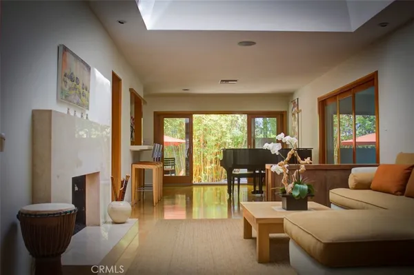 a living room with furniture and large windows