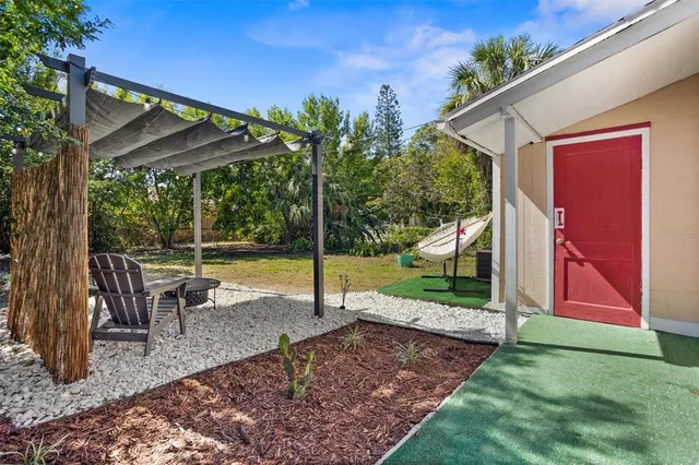 a view of a house with backyard from a patio