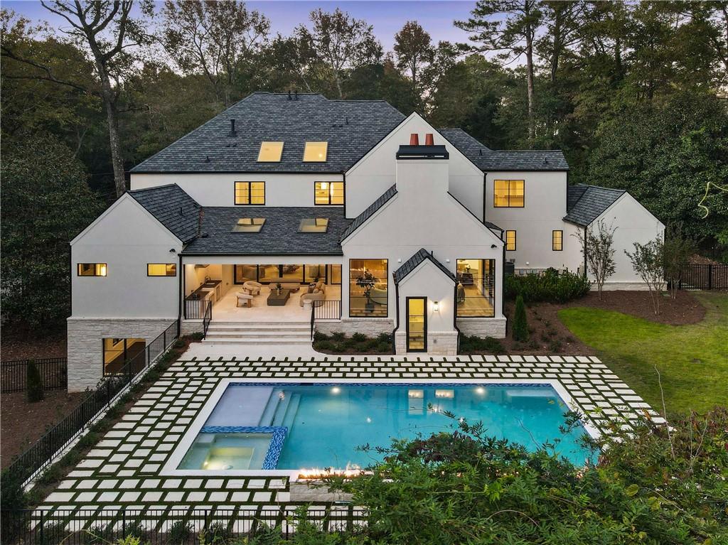 388 Londonberry Road Northwest Sandy Springs, GA 30327 - Photo 3 of 84 a front view of a house with a yard
