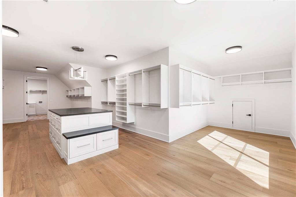 388 Londonberry Road Northwest Sandy Springs, GA 30327 - Photo 45 of 84 a view of a kitchen with wooden floor and electronic appliances