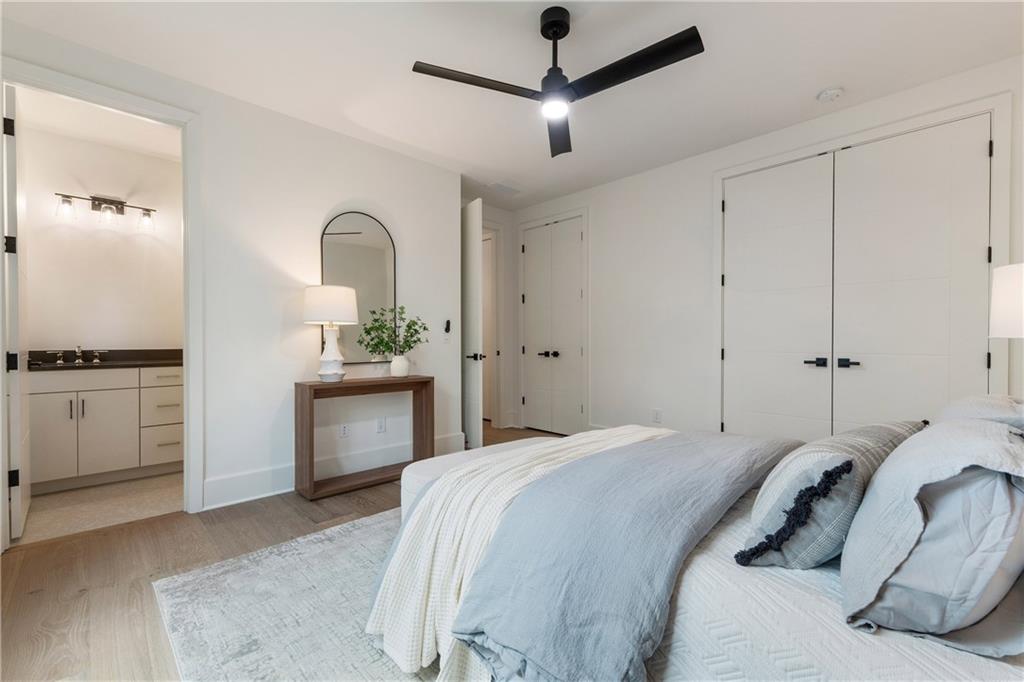 388 Londonberry Road Northwest Sandy Springs, GA 30327 - Photo 54 of 84 a bedroom with a bed and a chandelier