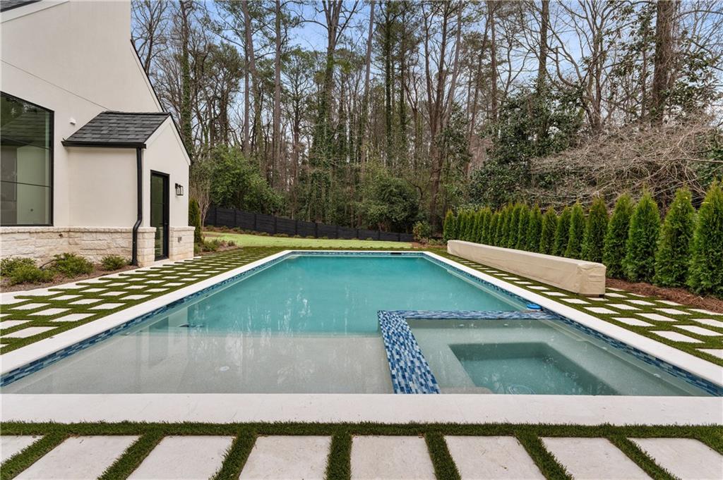 388 Londonberry Road Northwest Sandy Springs, GA 30327 - Photo 67 of 84 a view of a pool with a bench