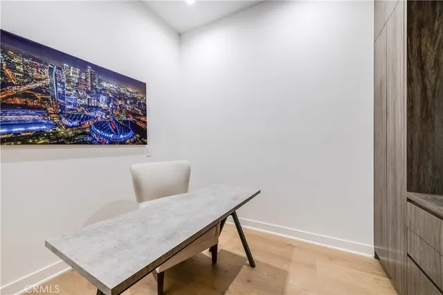 a view of a room with a table and chairs
