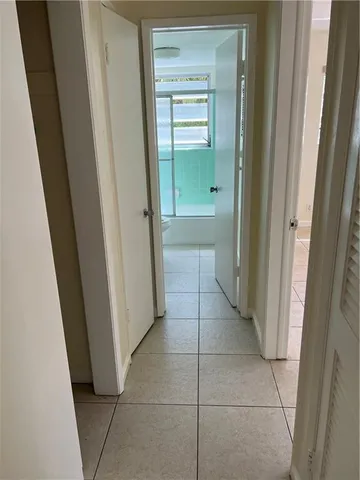 a view of a bathroom from a hallway