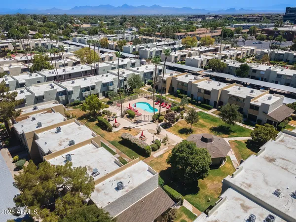 an aerial view of residential houses with outdoor space