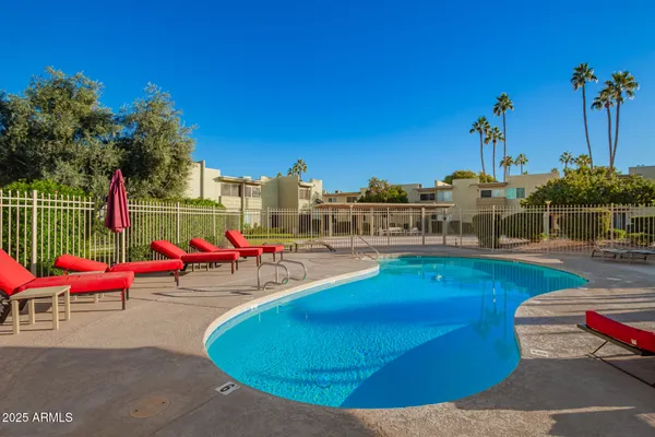 a view of a swimming pool with a sitting space