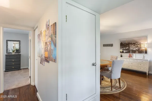 a dining room with furniture and wooden floor