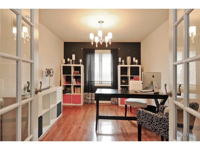 609 Homeland Road Matteson, IL 60443 - Photo 8 of 18 a living room with furniture a chandelier and a dining table