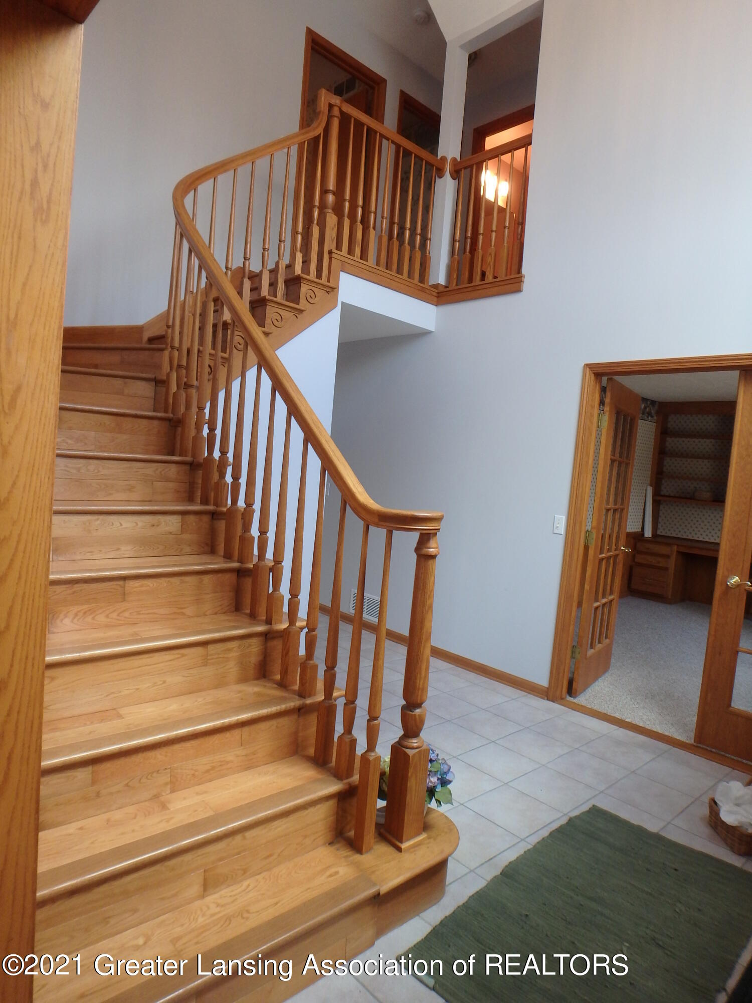 2565 Narrow Lake Road Charlotte, MI 48813 - Photo 16 of 63 2565 open curved staircase