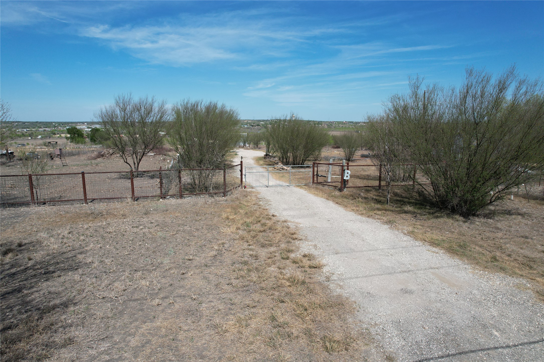 1205 Graef Road, Unit B Kyle, TX 78640 - Photo 3 of 18 a view of a yard with furniture and a bench