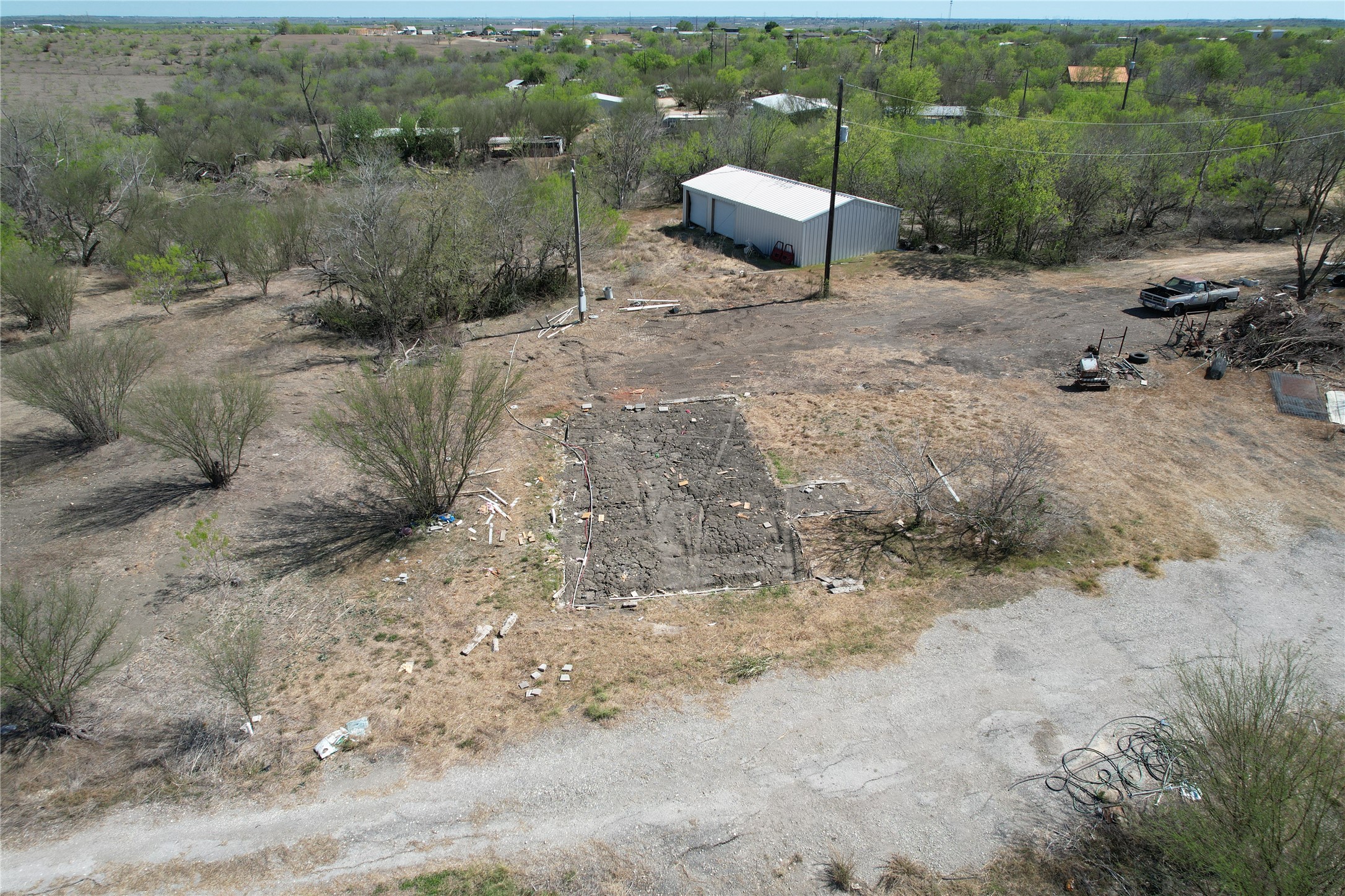 1205 Graef Road, Unit B Kyle, TX 78640 - Photo 6 of 18 a view of a backyard with table and chairs with wooden fence