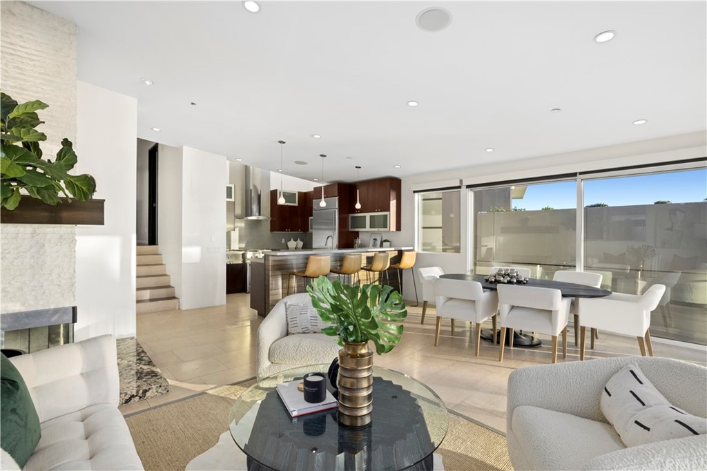 970 Baja Street Laguna Beach, CA 92651 - Photo 2 of 27 a living room with fireplace furniture and a large window