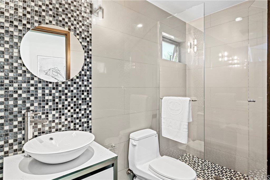 970 Baja Street Laguna Beach, CA 92651 - Photo 13 of 27 a bathroom with a toilet and a sink