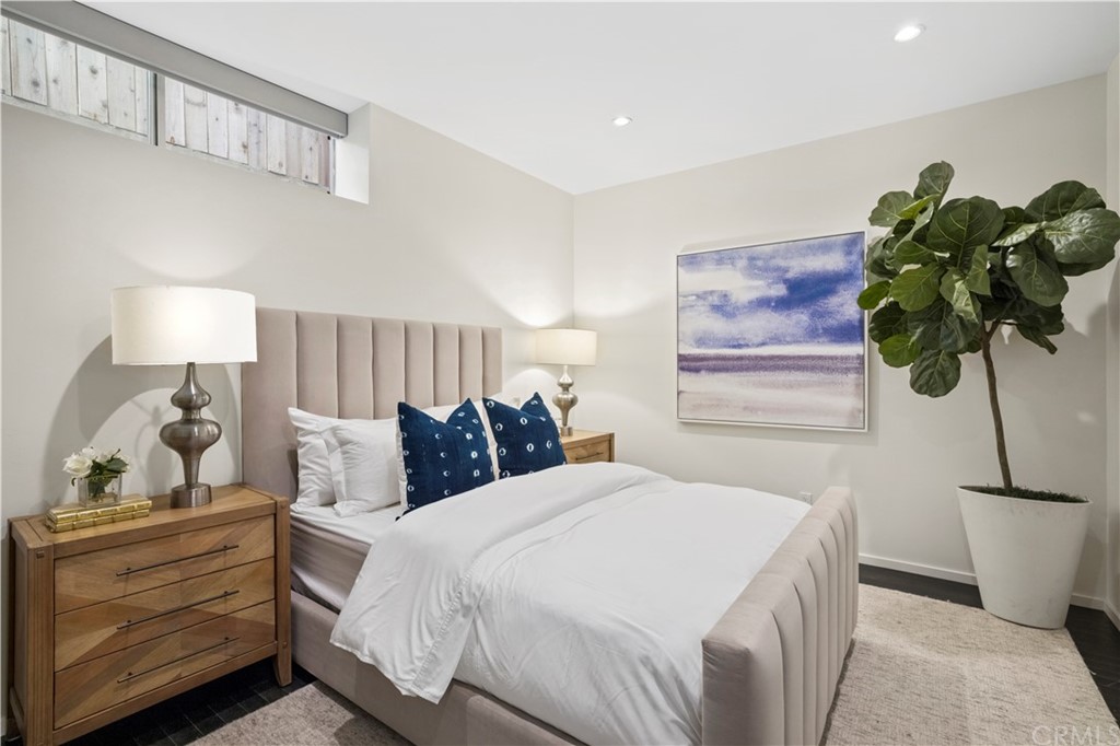 970 Baja Street Laguna Beach, CA 92651 - Photo 20 of 27 a bedroom with a bed and a potted plant